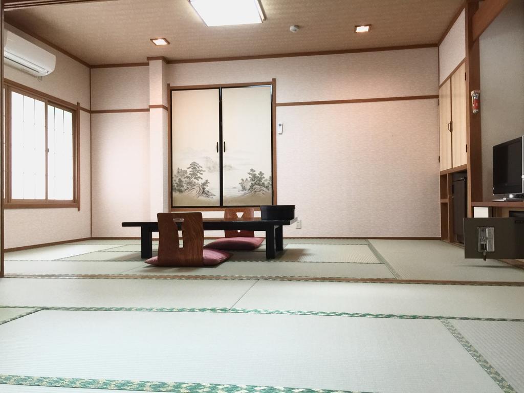 Готель Okumizuma Onsen Kaizuka Екстер'єр фото
